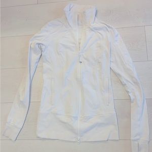 Lululemon white zip-up top.